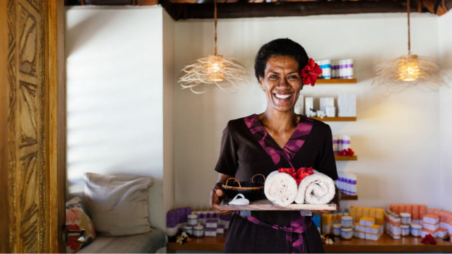 Beautician smiling and welcoming guests at Baravi Spa in the Yasawa Islands, Fiji