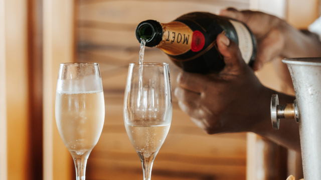 Champagne at Turtle Island Resort Two champagne glasses clinking at Turtle Island Resort Ask ChatGPT