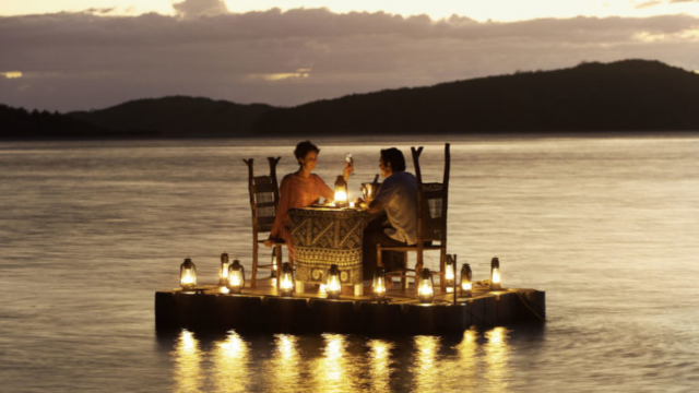 Romantic Dinner Turtle Island Resort Romantic dinner setup on floating platform at Turtle Island Resort
