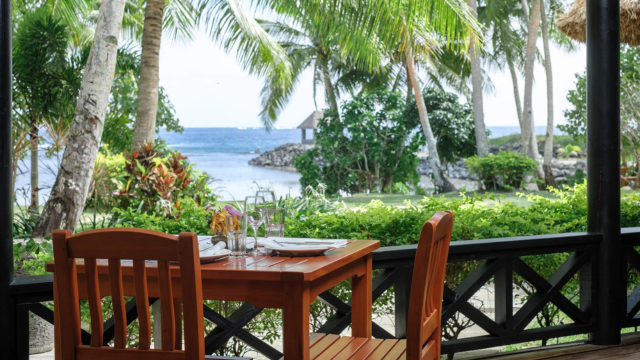 Dining table on veranda with scenic view at Waya Island Resort