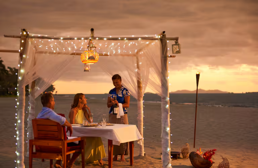 beach suset beach sunset couple romantic meal champagne server